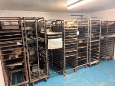 Fourteen various multi-tier steel baking trollies and trays