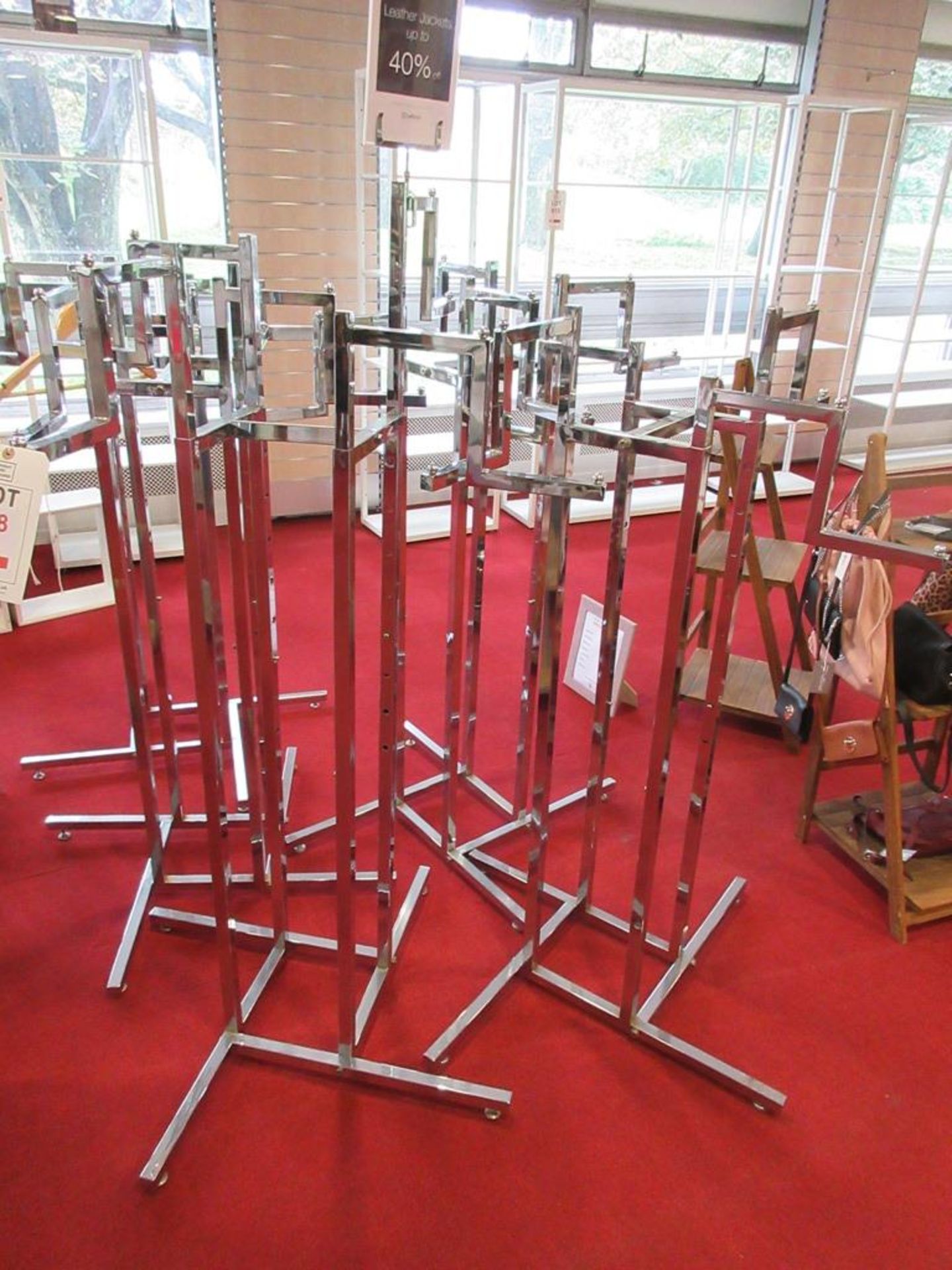 Five chrome adjustable high clothes stands, two mannequins