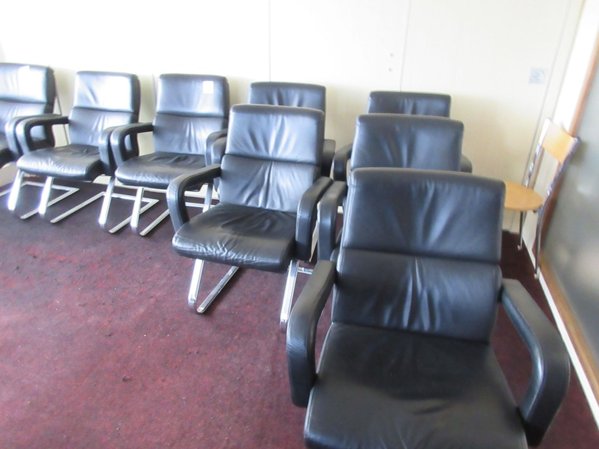 Two leatherette swivel manager's armchairs