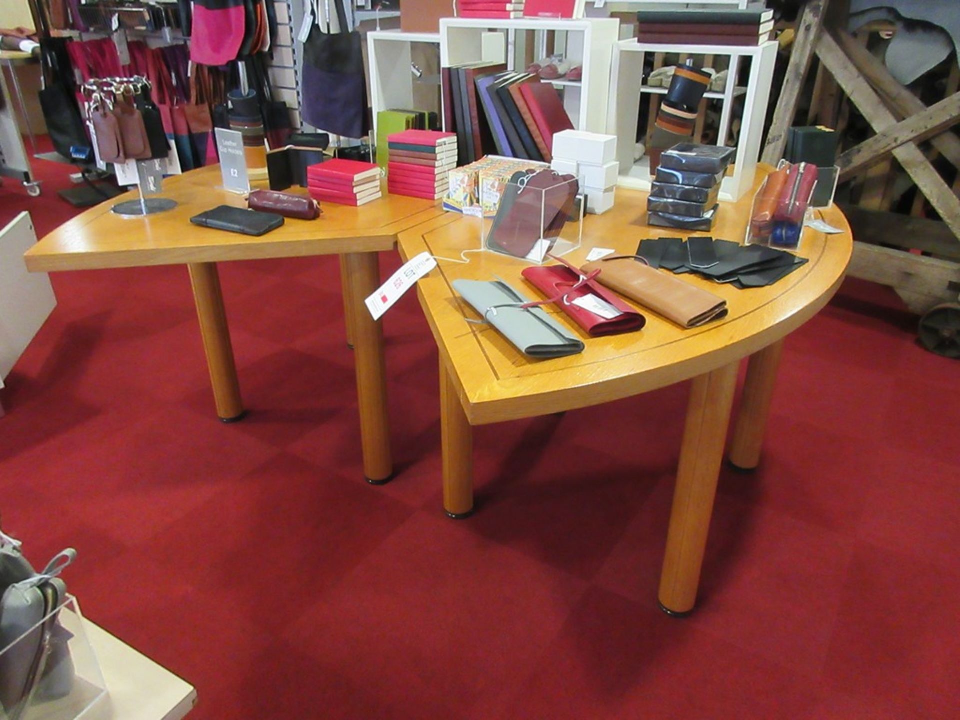 Two light wood effect tables, 1.7m x 900mm (excluding contents) and one wood effect table 750 x