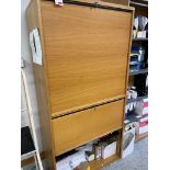 Four wood effect tambour fronted storage cupboards