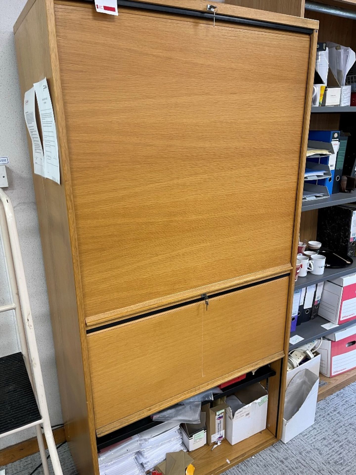 Four wood effect tambour fronted storage cupboards