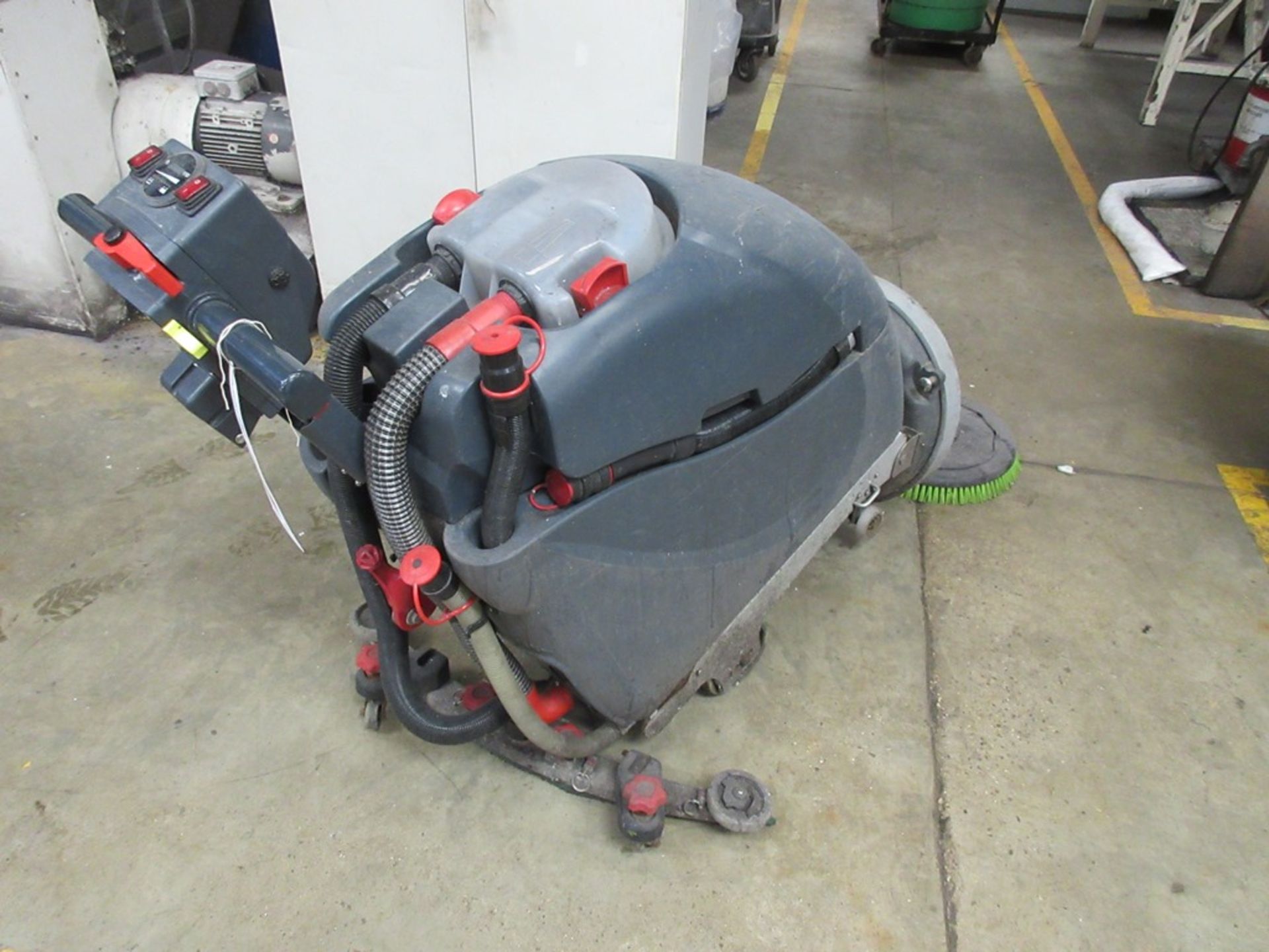 Numatic International battery operated pedestrian floor scrubbing machine, model TGB4045/100, serial