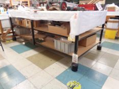 Six assorted large lay up tables (four wooden and two metal) (excludes contents)