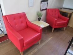 Two red leather reception chairs, one light wood effect side table