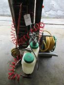 Miscellaneous lot including reeled hose pipe, car ramps, jerry can, wheelbarrow, tyre inflator, weed