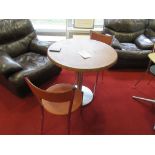 Two leather topped tables and four leather chairs