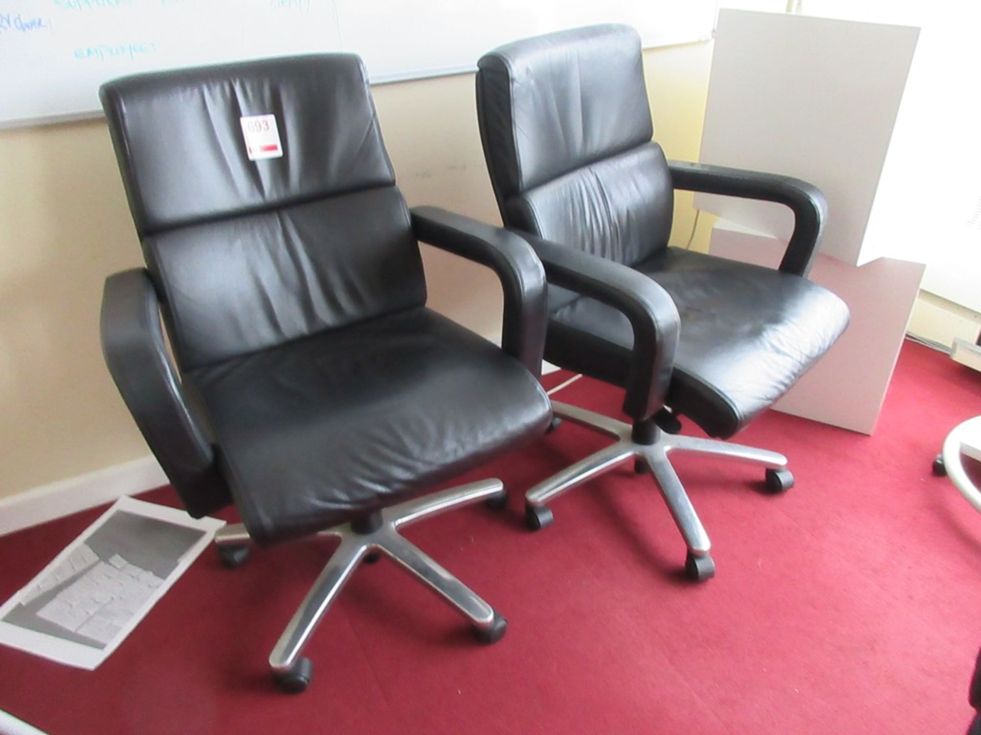 Two leatherette swivel manager's armchairs