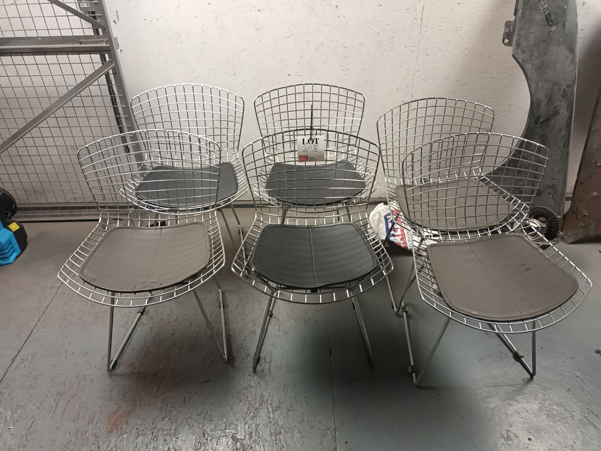 Six metal frame garden chairs with black seat cushion