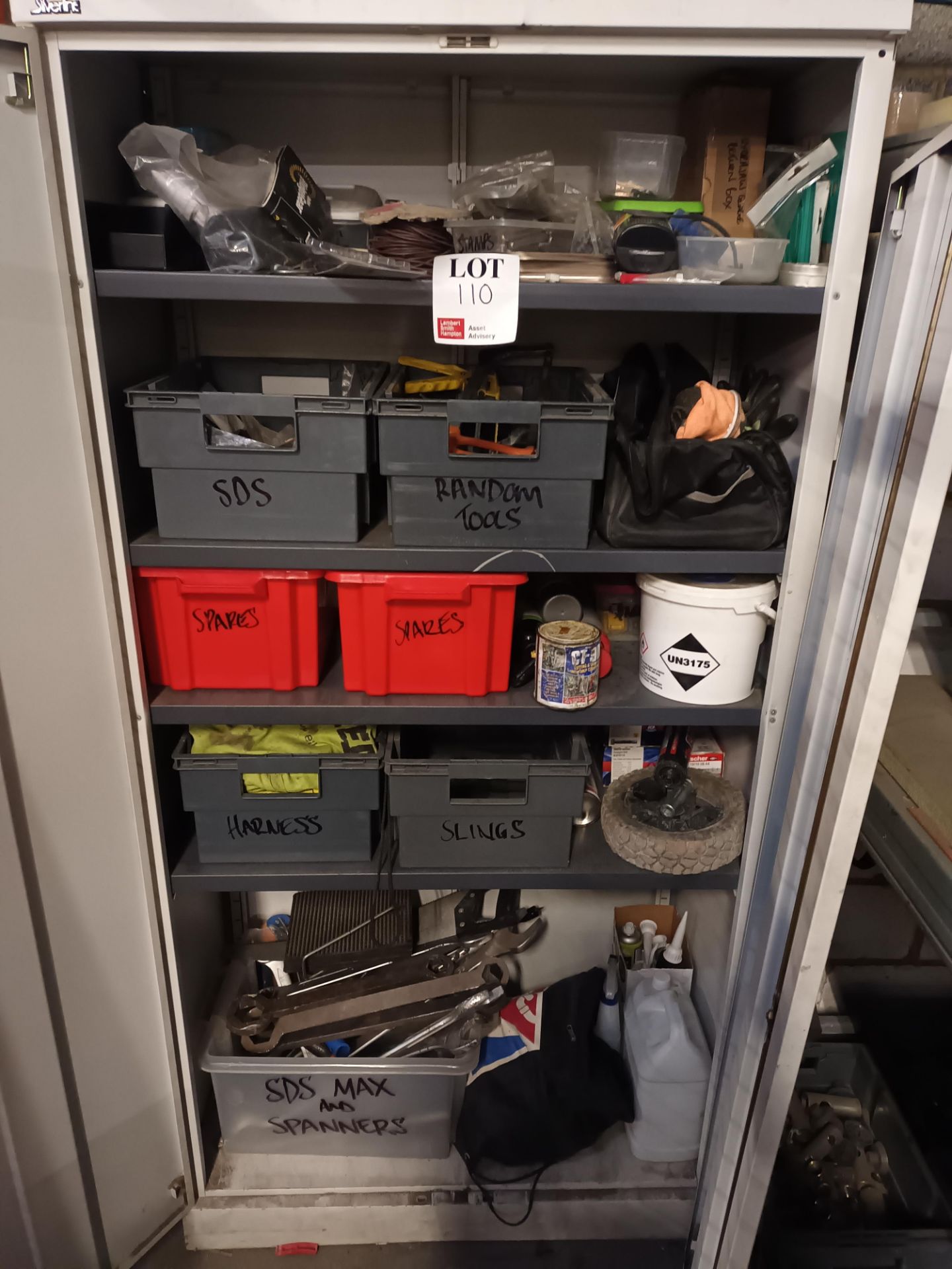 Two door metal cabinet and contents to include various hand tools (as lotted)