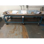 Metal framed workbench on wheels (approximately 250cm (L) x 75cm (H) x 125cm (W)) (Excludes contents