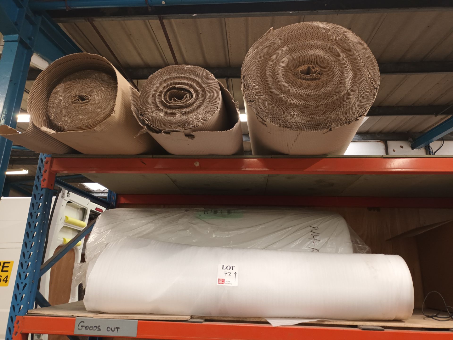 Three rolls of packing cardboard and two rolls of packing foam