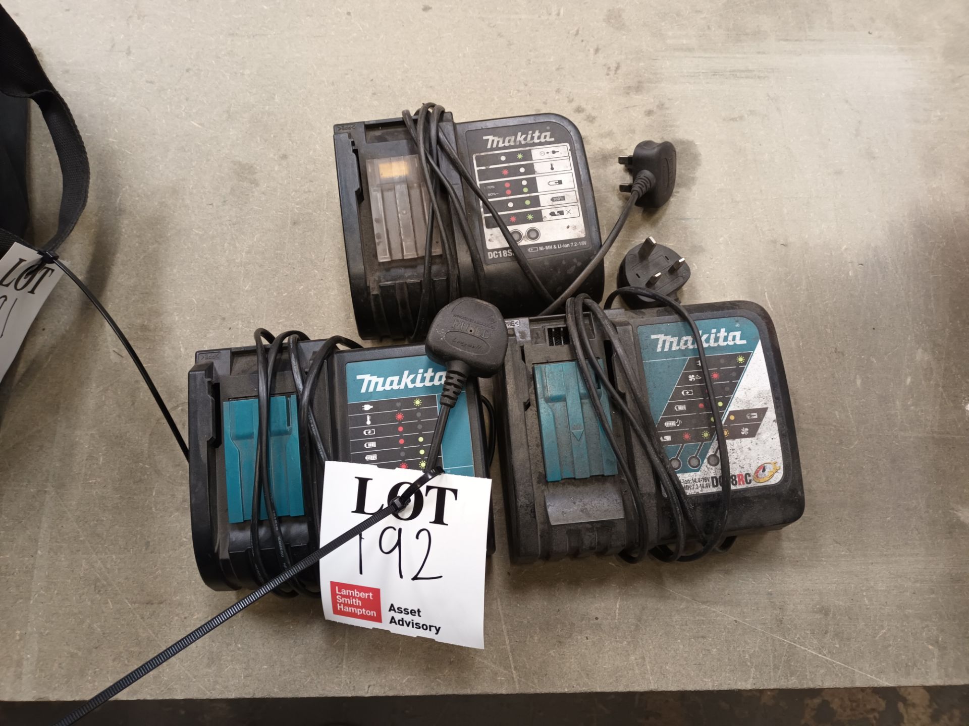 Three various Makita battery chargers