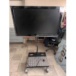 Sharp Aquos television on mobile tv stand