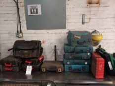 Fourteen various empty tool carry cases
