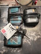 Three various Makita battery chargers