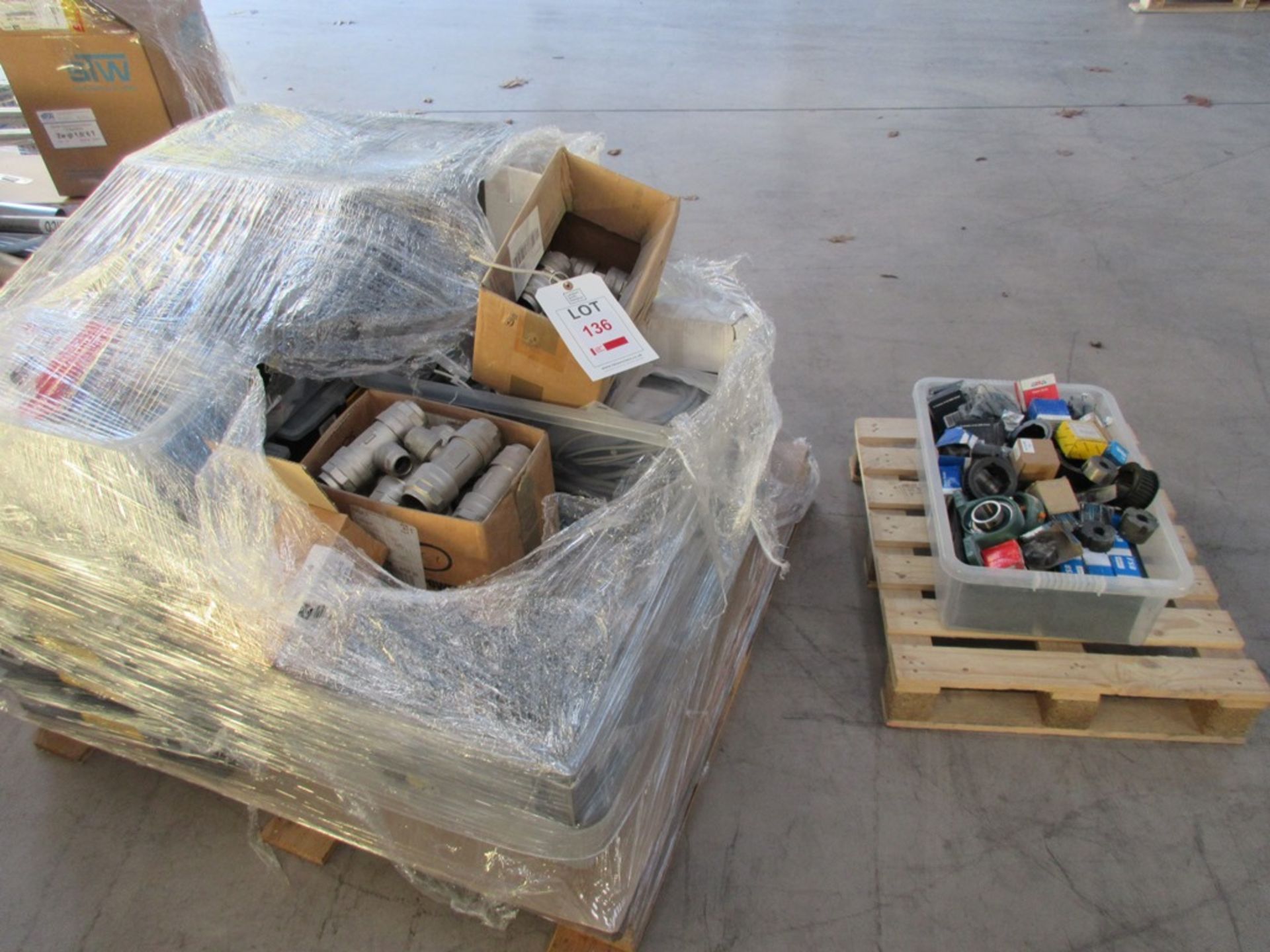 Pallet of assorted stock to include pipe fittings, ball & roller bearings, roller chain, tool