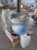 Pallet of assorted foam reels, steel spacer fittings, and caster wheels