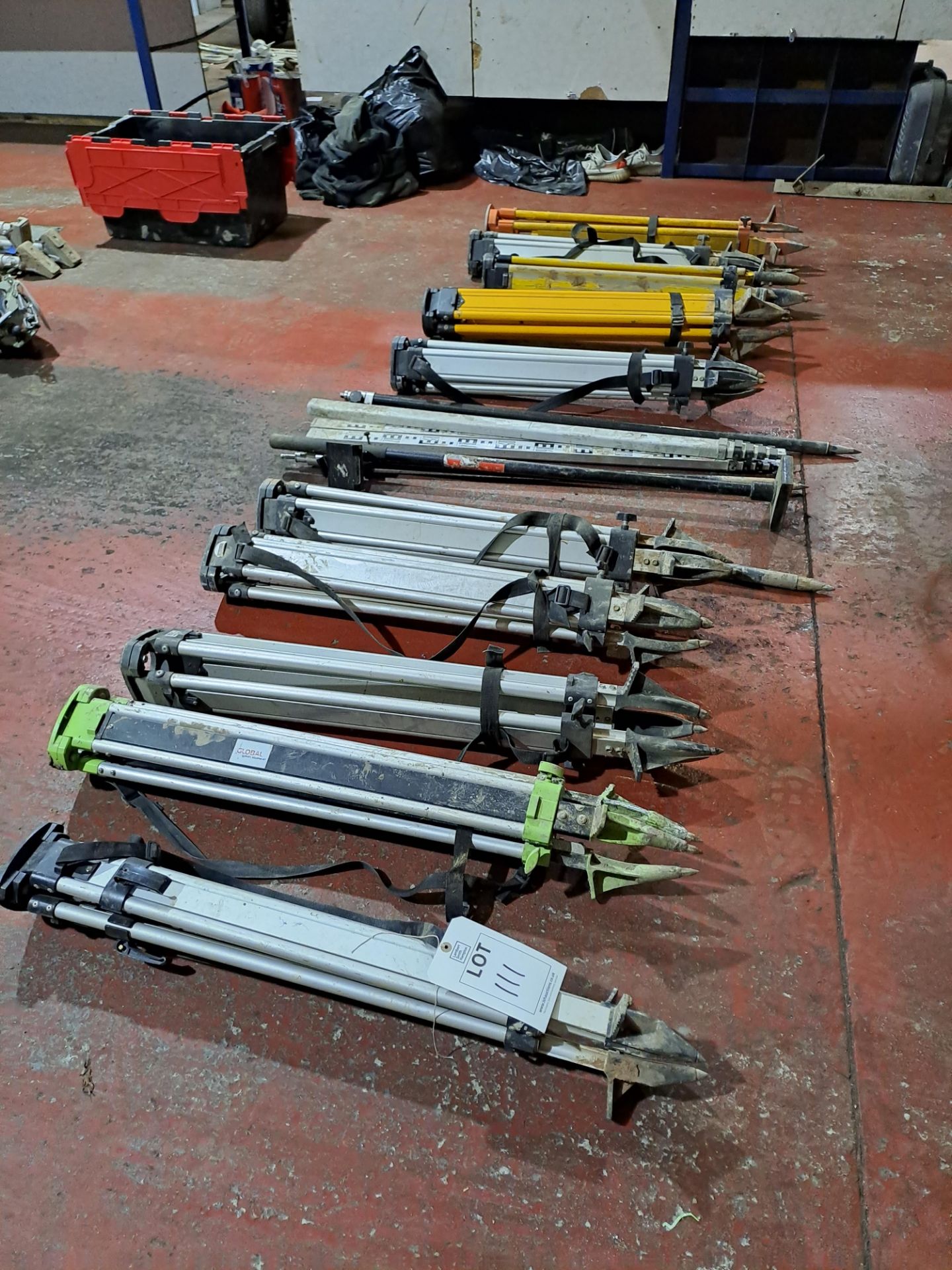 Quantity of surveyors tools including approx. 9 x tripods, telescopic levelling staffs etc.