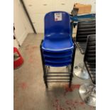 Four blue plastic tall stacking chairs