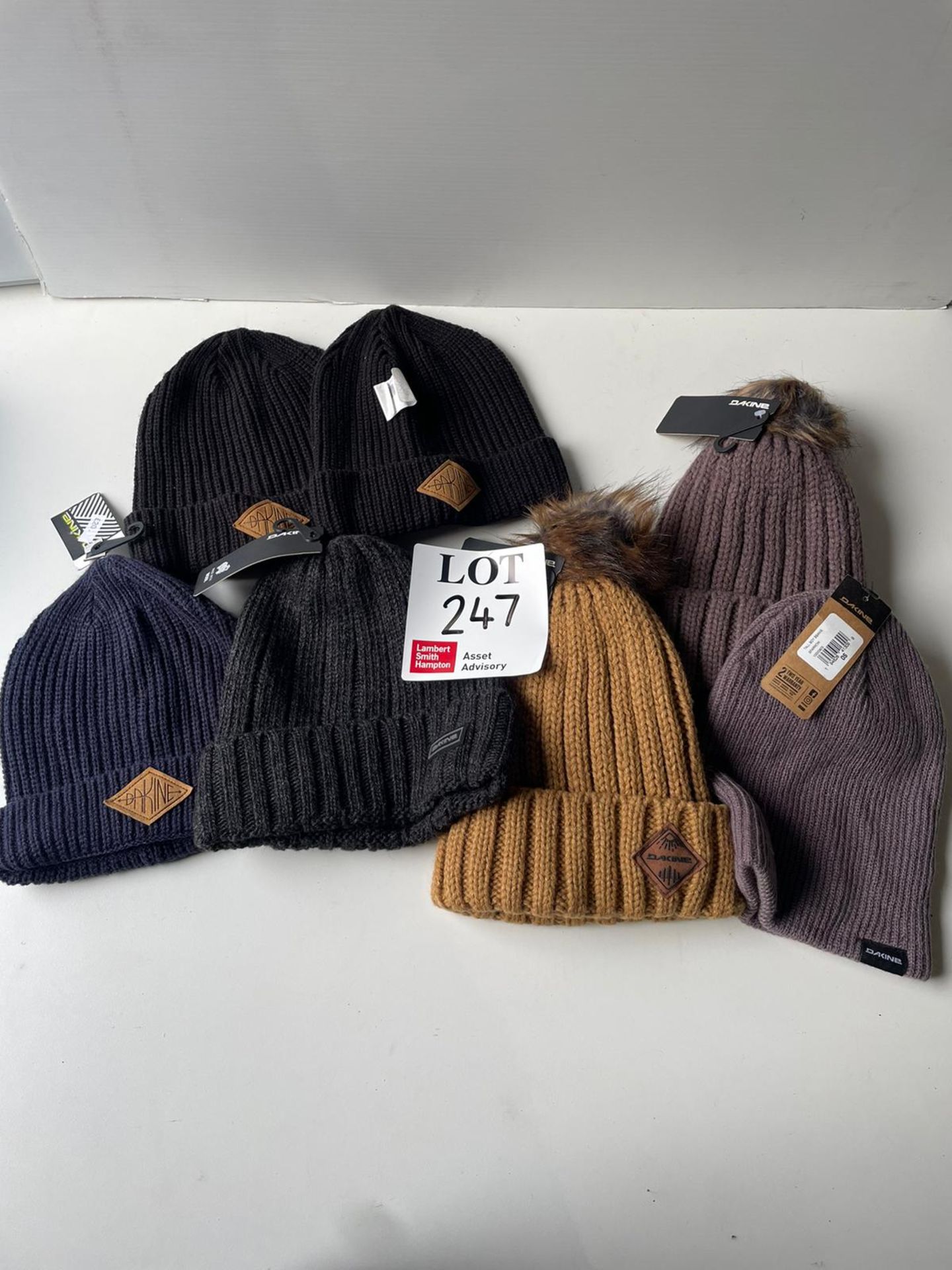 Five Dakine adults beanies and two bobble hats