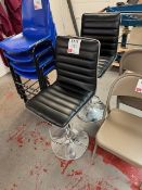 Two chrome and black tall chairs