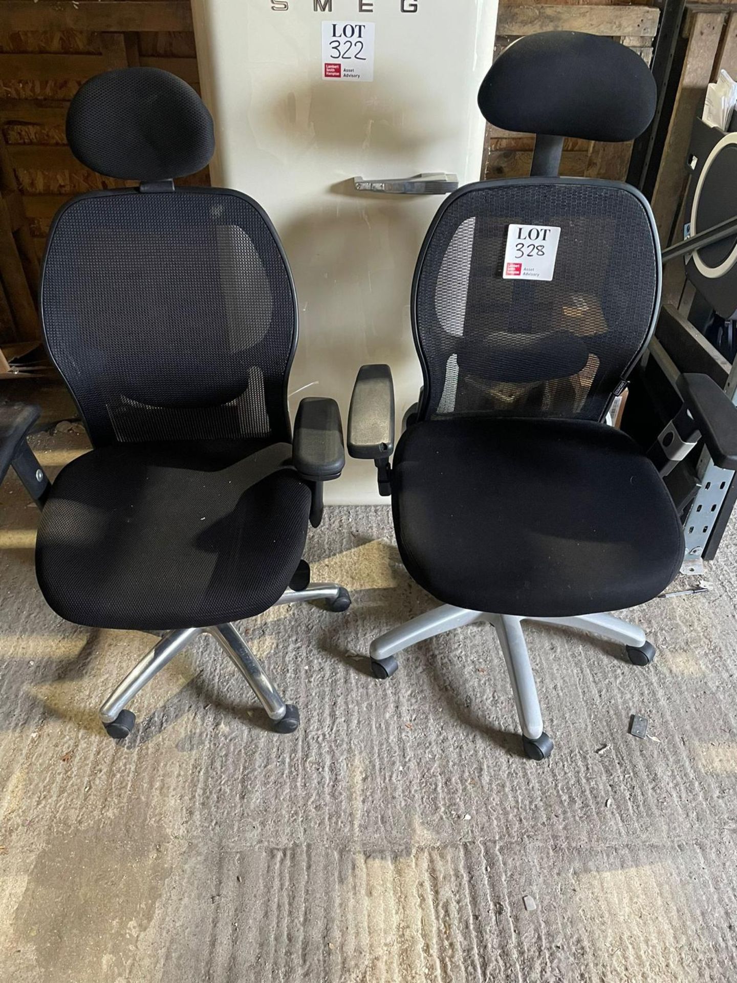 Two black mesh back operator chairs