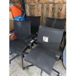 Four black mesh back operator chairs