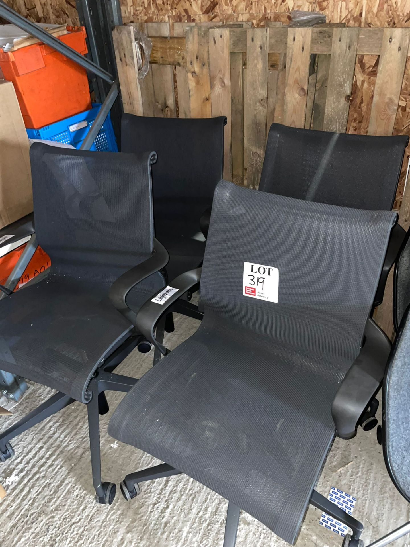 Four black mesh back operator chairs
