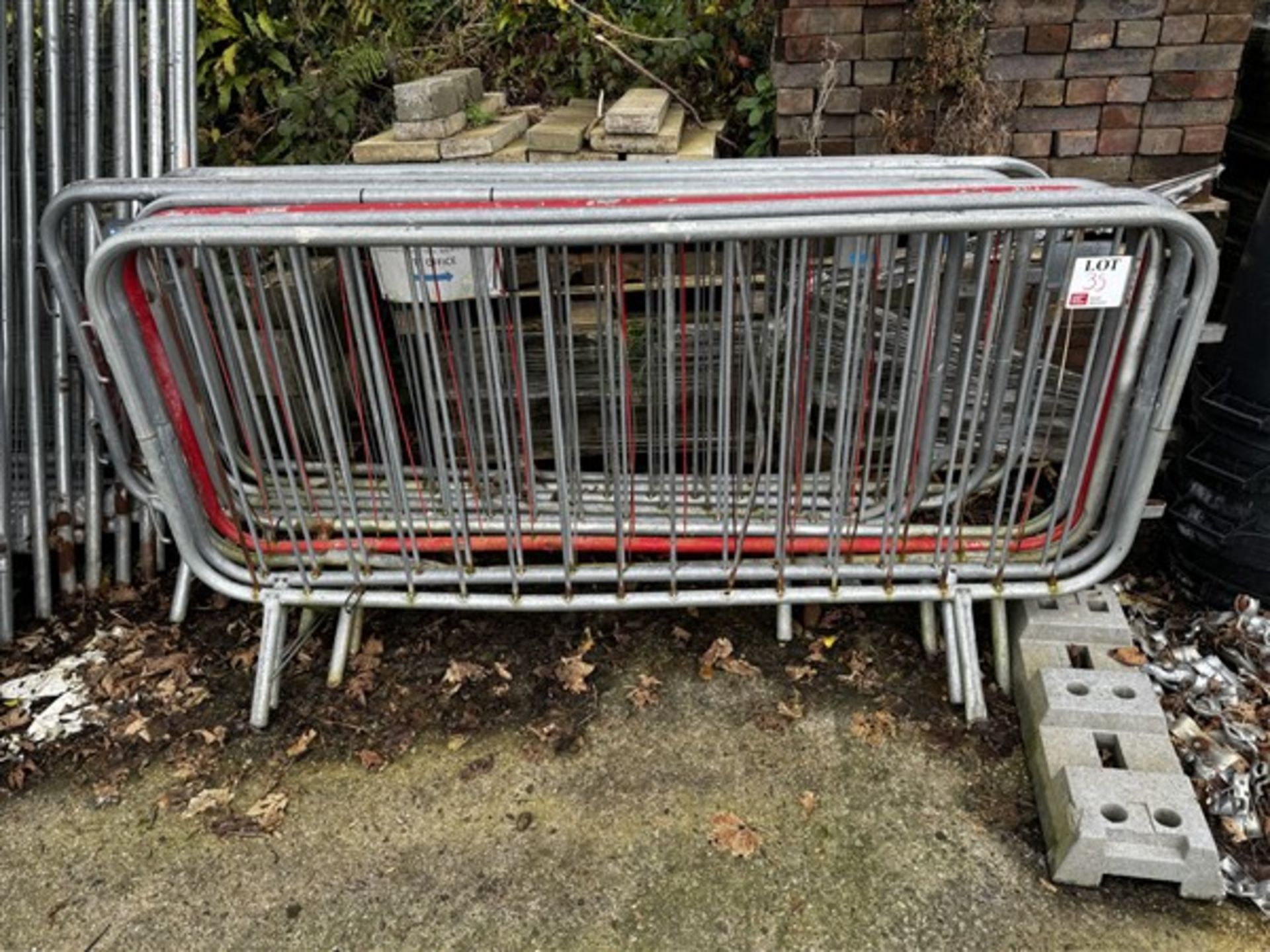 Assorted quantity of metal and plastic pedestrian barriers