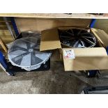 One Toyota 17" wheel, one VW 19.5" hub cap with assorted car mats