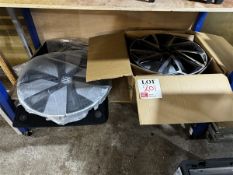 One Toyota 17" wheel, one VW 19.5" hub cap with assorted car mats