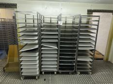 Four 14-shelf stainless steel trolleys with 16 spare shelves