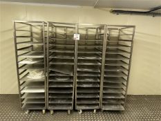 Four 14-shelf stainless steel trolleys with 16 spare shelves