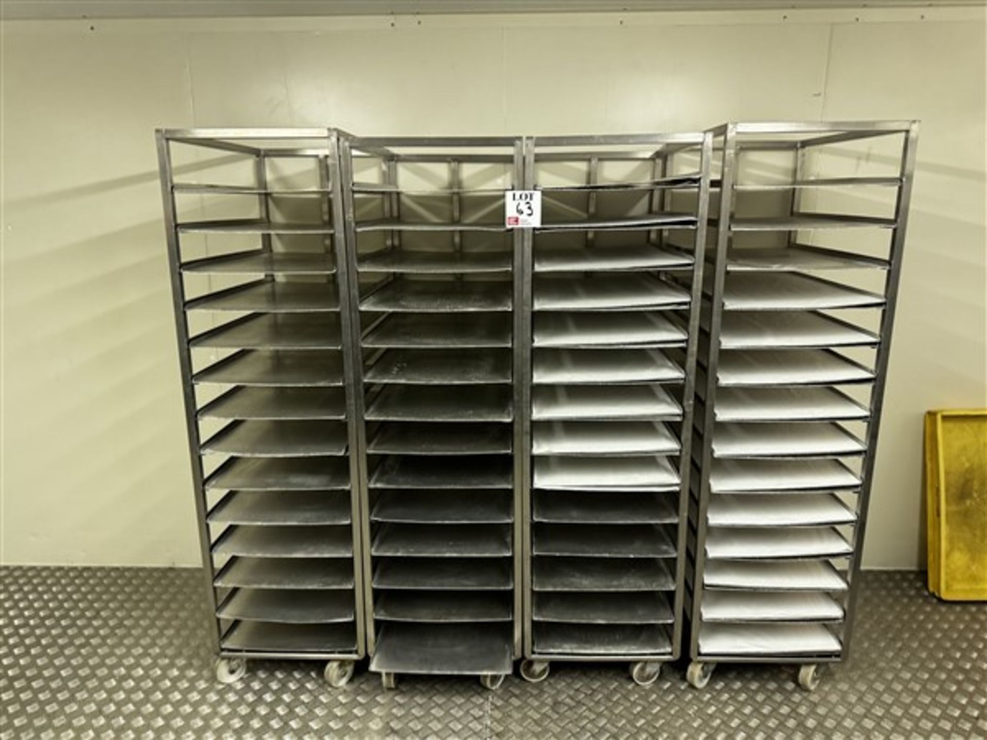 Four 14-shelf stainless steel trolleys with 16 spare shelves