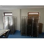 Five 14-shelf stainless steel trolleys with 20 spare shelves