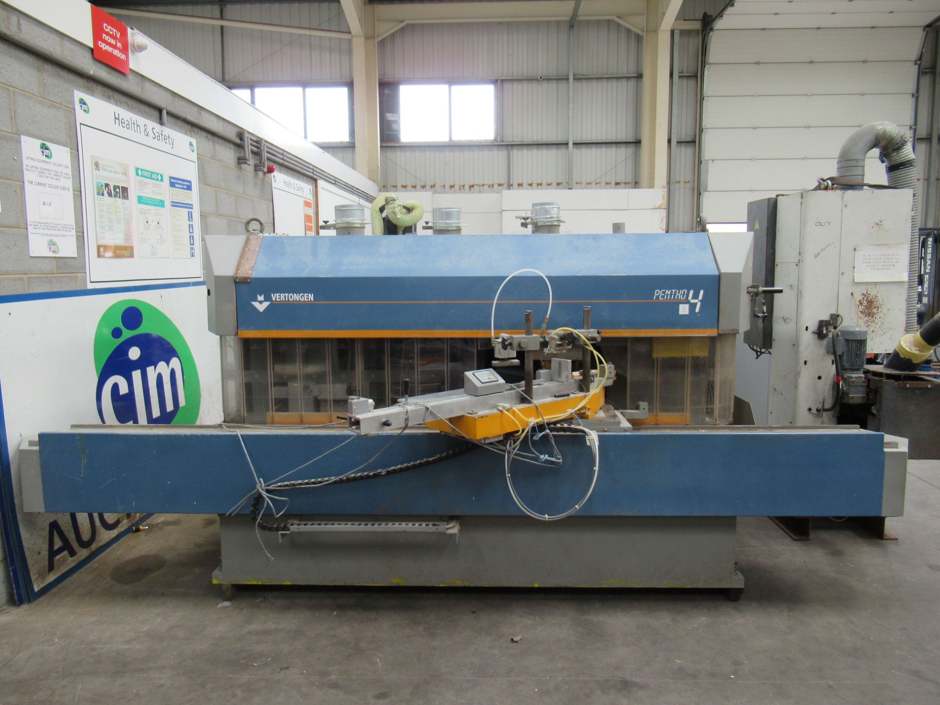 Vertongen Pentho4 Tenoning Machine together with a control panel.