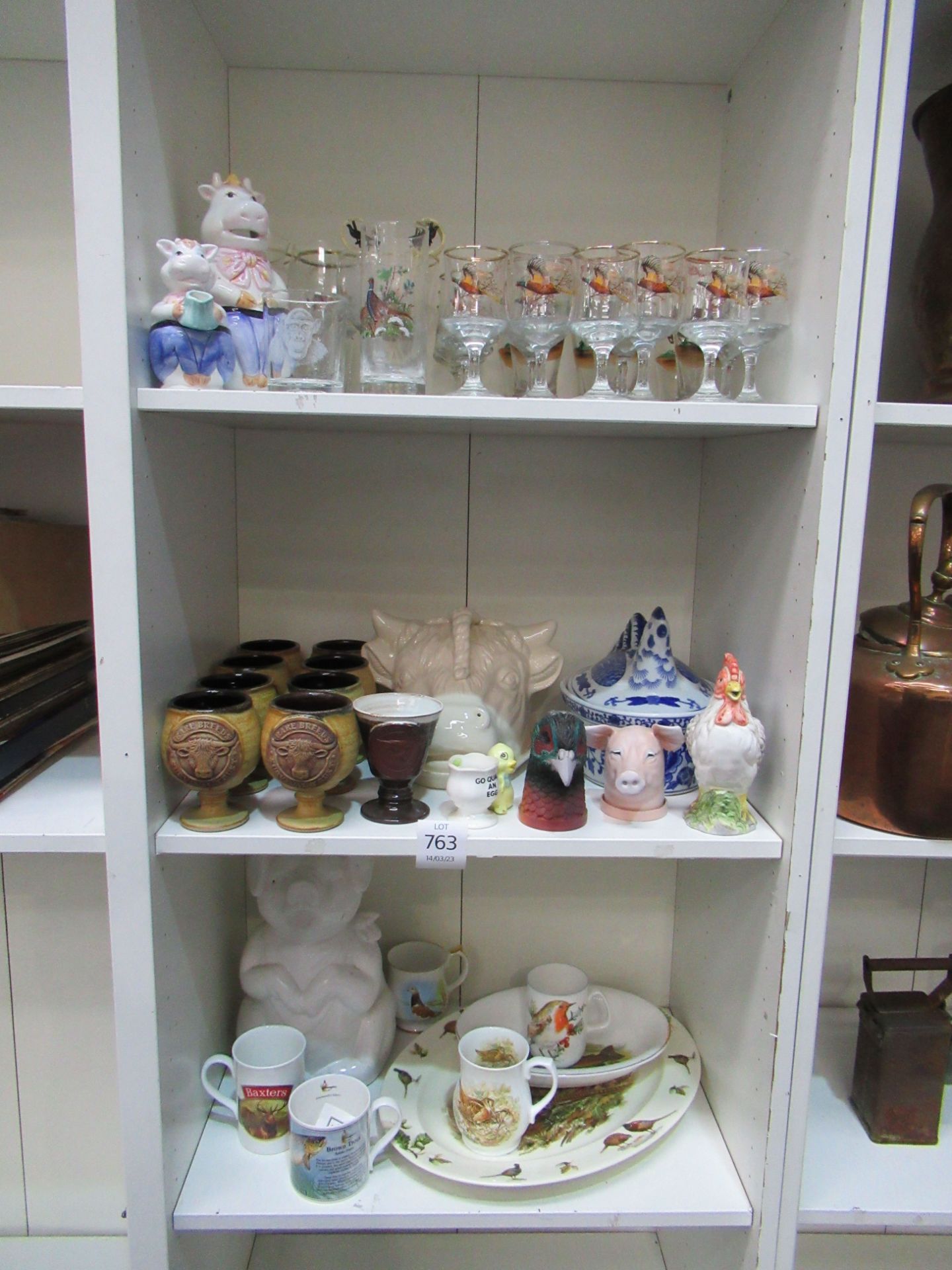 3x shelves of various animal themed pottery and glassware