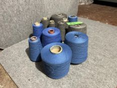 Mixed blue and grey yarn cones