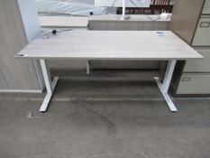 An electric rise and fall office desk (H 1200mm max height, H700mm min height, W1600mm, D800mm)