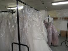 11 various bridal gowns and 2 dresses to rail