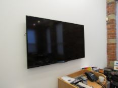 Sharp Aquos 60in wall mounted smart television with remote; (DRINK) Located: Fabric House, Holly