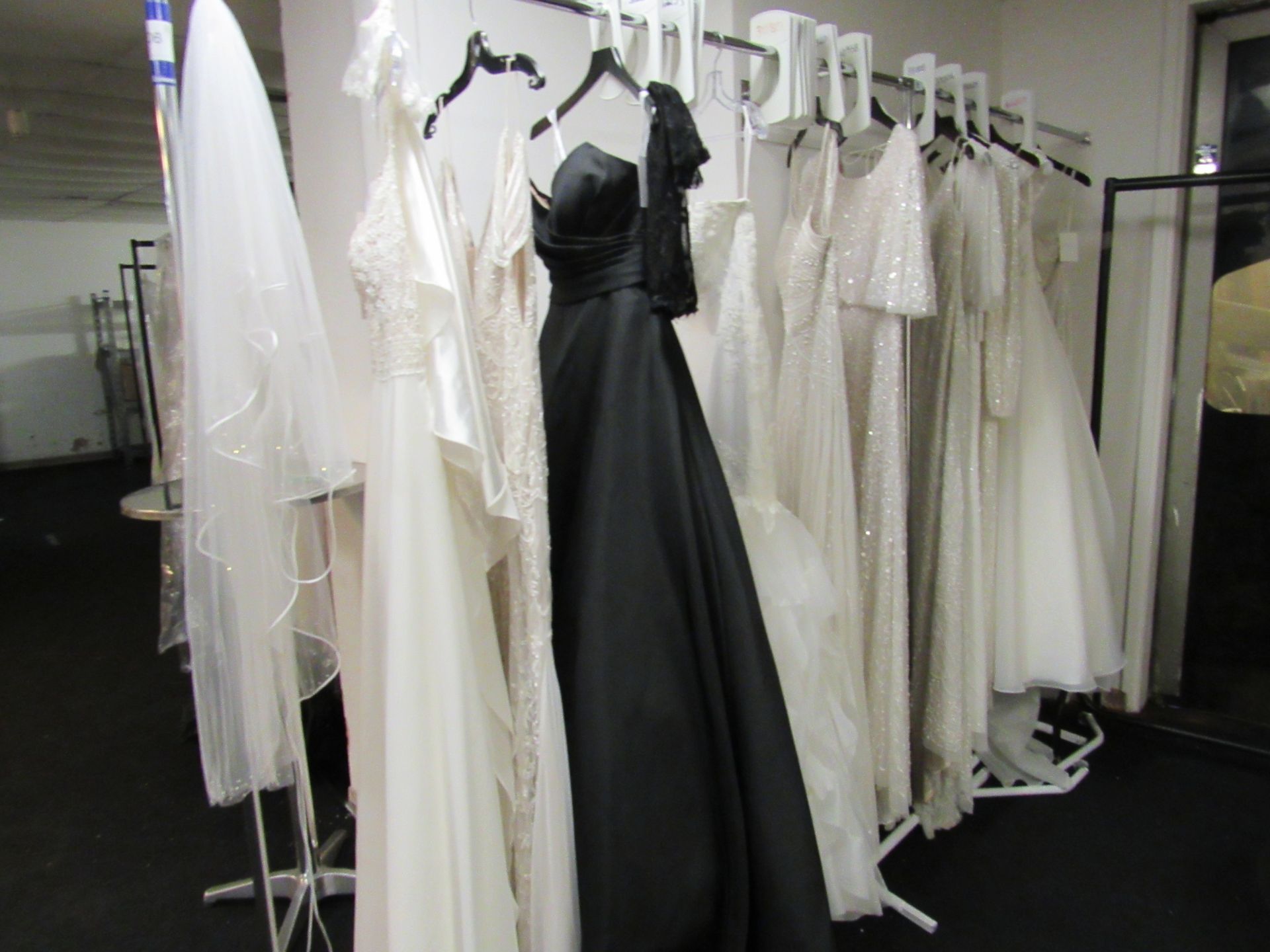 12 various bridal gowns to rail