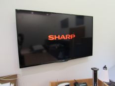 Sharp Aquos 60in wall mounted smart television with remote; (Sleep) Located: Fabric House, Holly