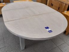 Light grey topped wooden circular extendable dinin