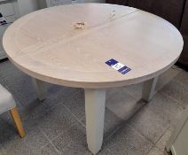 Light grey topped wooden circular extendable dinin