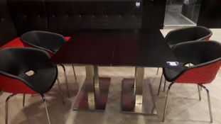 4 x Metamobil red plastic stackable chairs and 2 x chrome based pedestal tables (1,200mm)