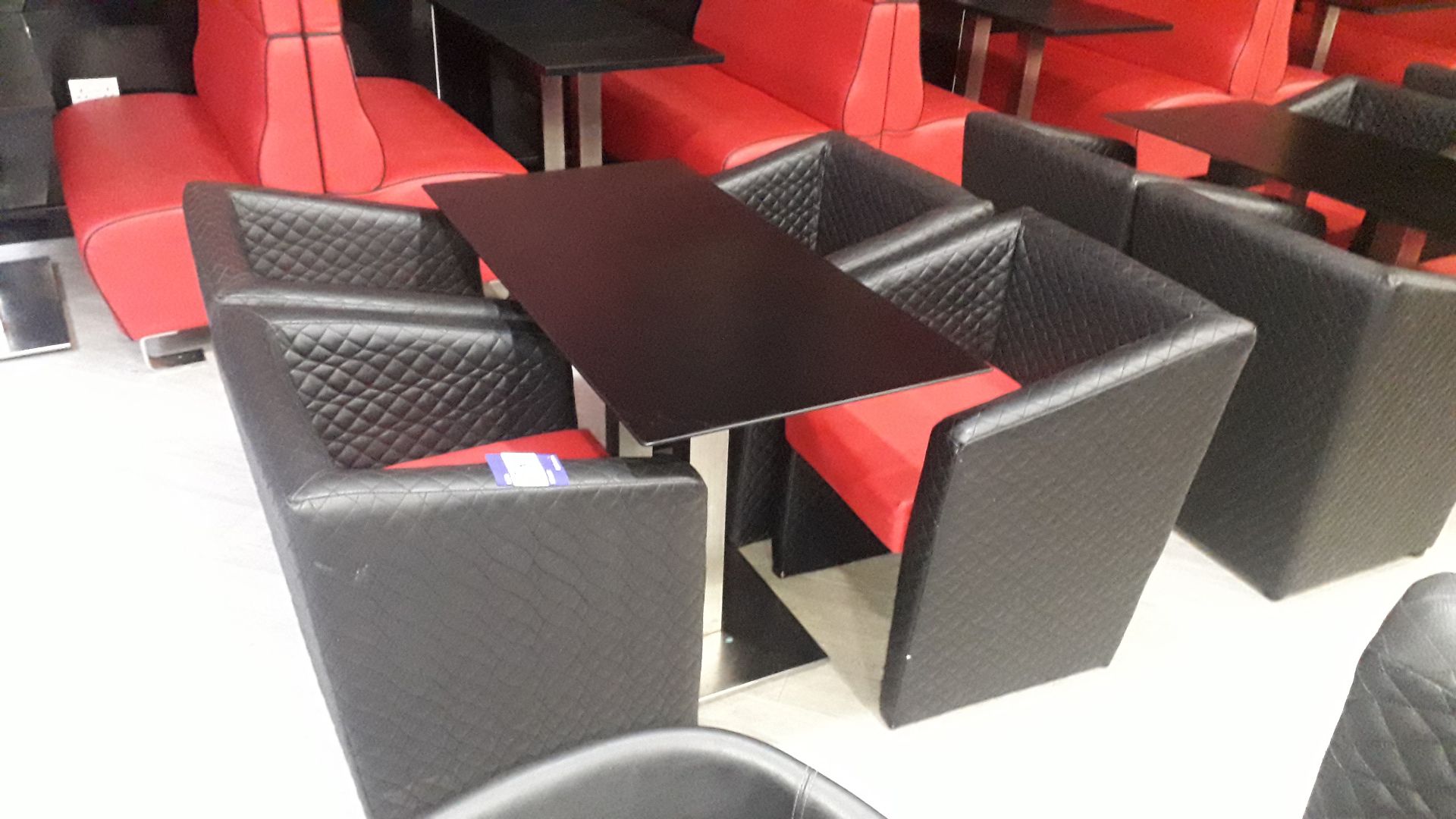 4 x black & red faux leather upholstered chairs and chrome based pedestal table