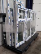 2 x Sheet stock racks with fork truck mounting, and contents to include uPVC window frames (glazed)