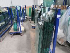 5 mobile glass trollies with quantity of various g